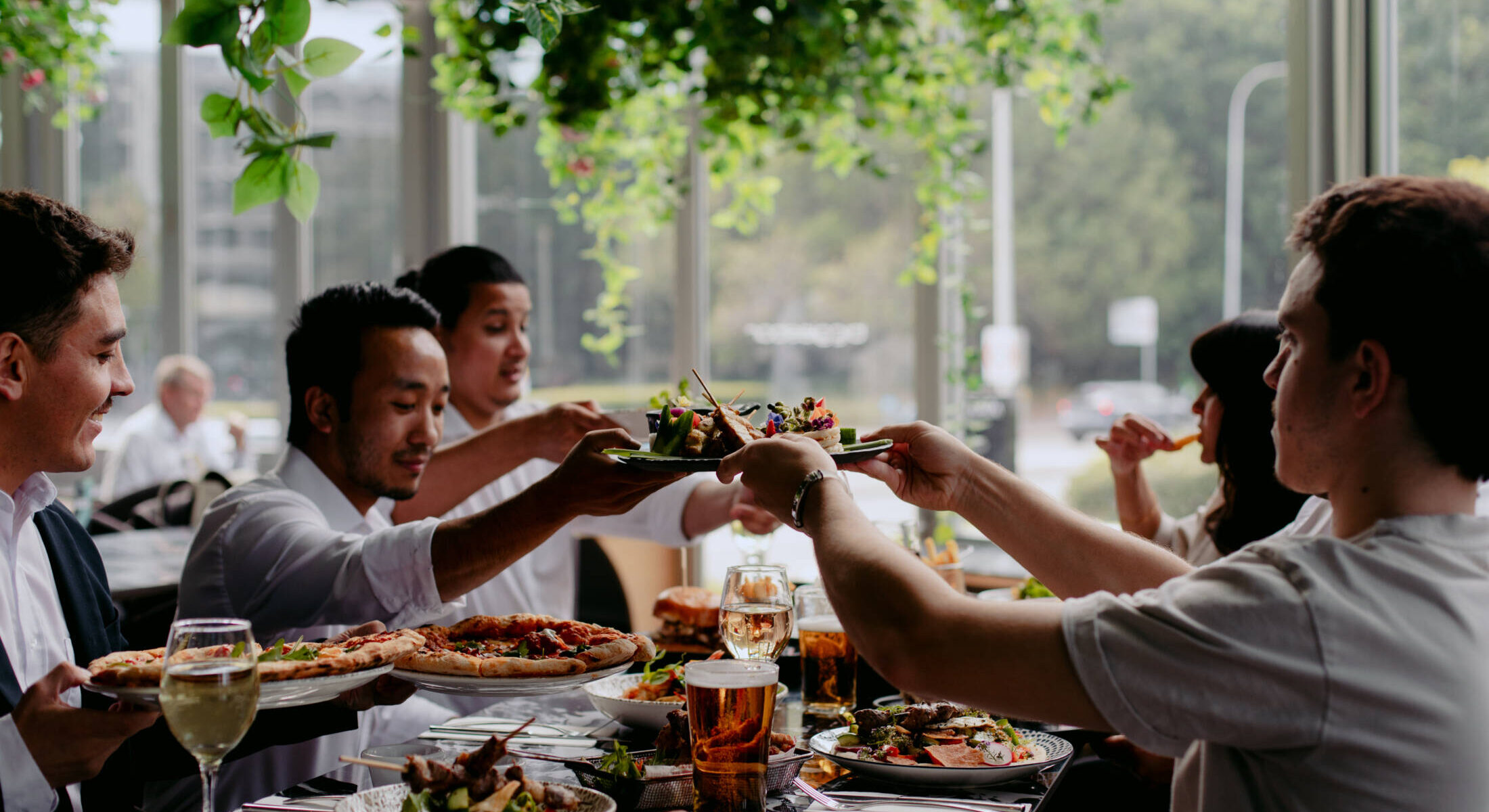 Group sharing a meal at Biggles Bar & Grill